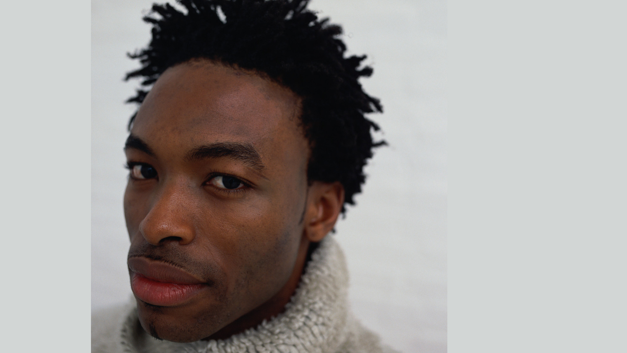 african american young man in a sweater