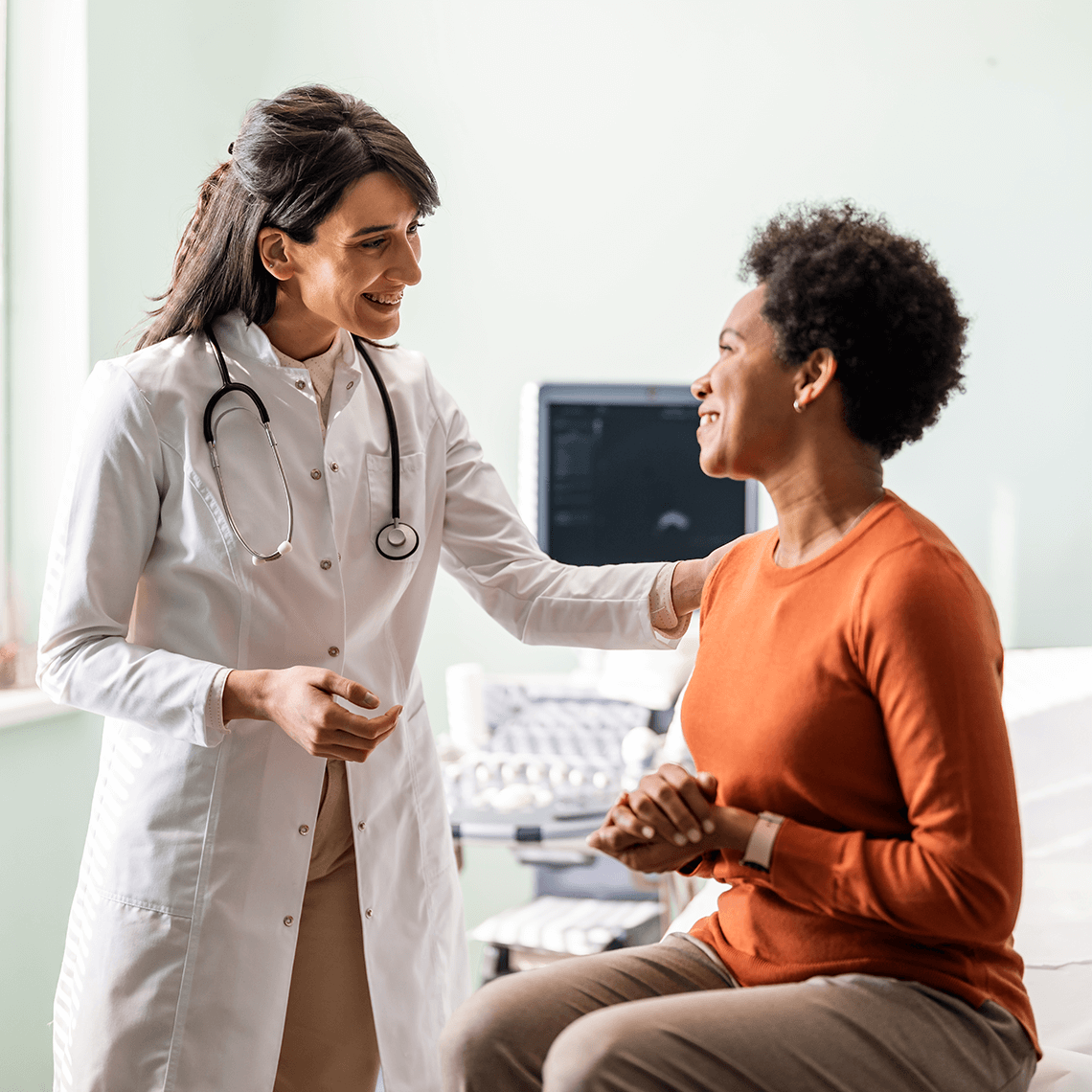 Female doctor with african american female patient