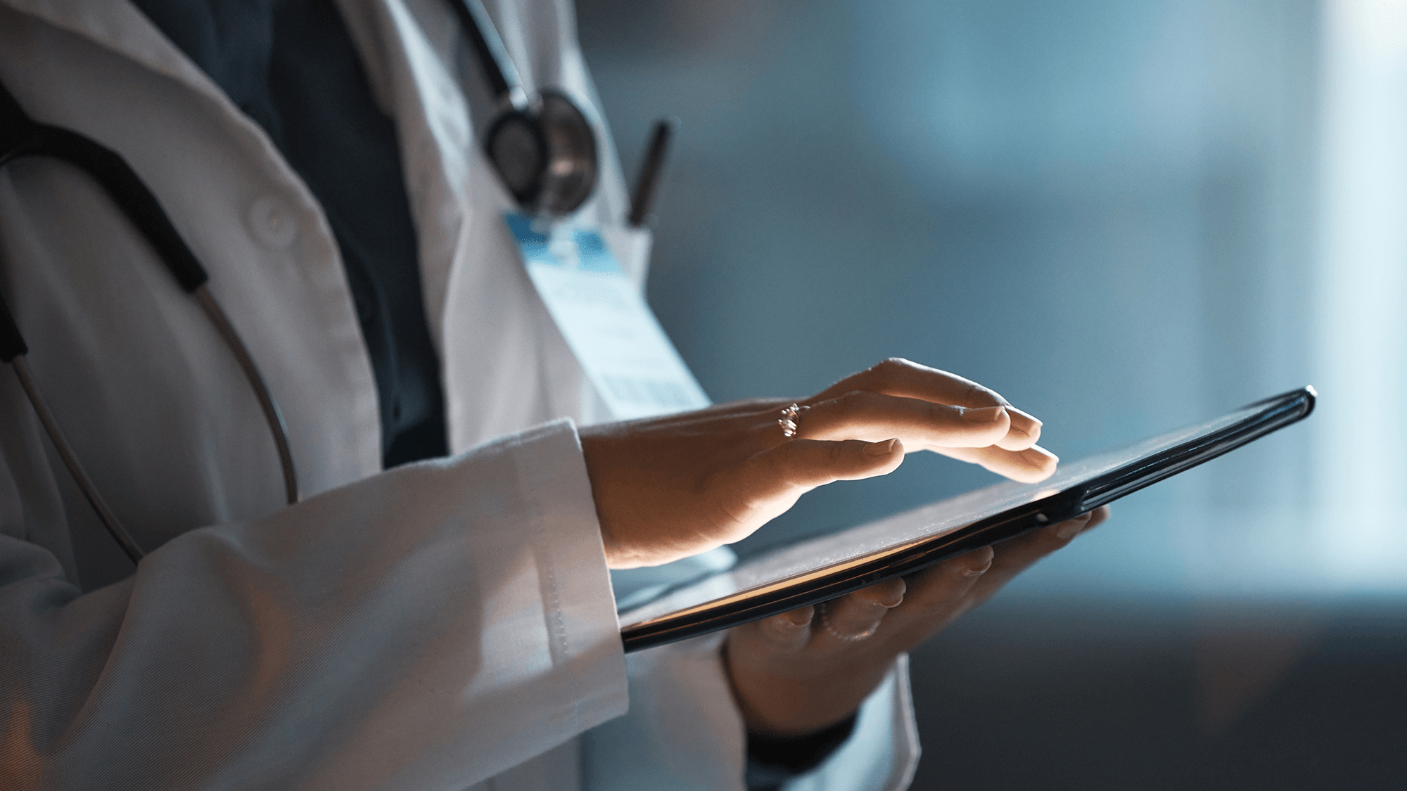 closeup of a clinician using a tablet