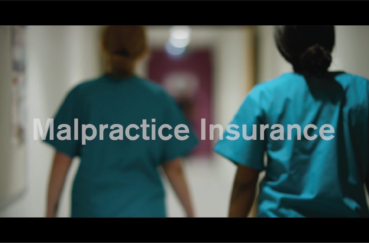 nurses walking away down a hall